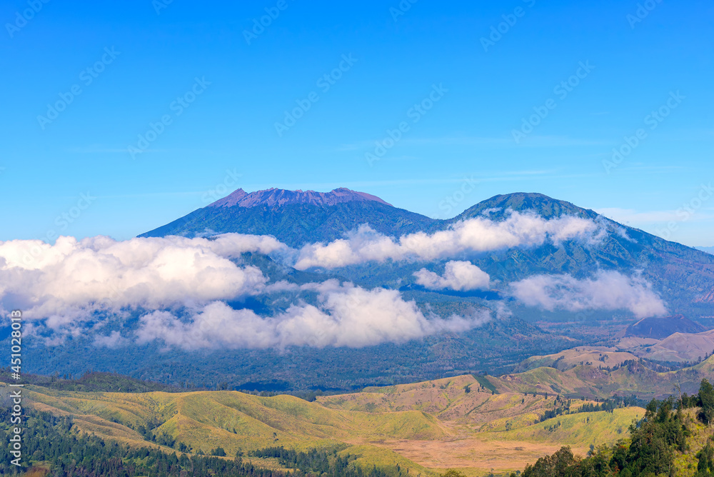 Landscape view of Mount Raung seen from of Mount Ijen, Banyuwangi, East Java, Indonesia.