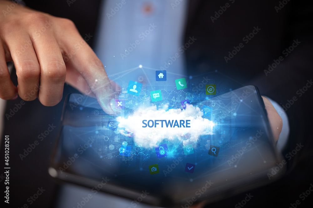 Businessman holding a foldable smartphone, technology concept Businessman holding a foldable smartphone, technology concept