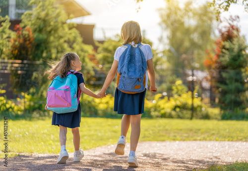 Girls with backpack are going to school