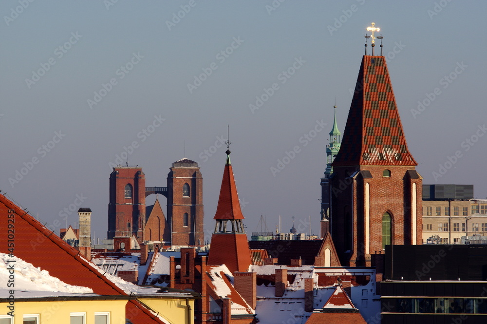a view on the roofs of the marketplace in wrocław during a snowy winter
