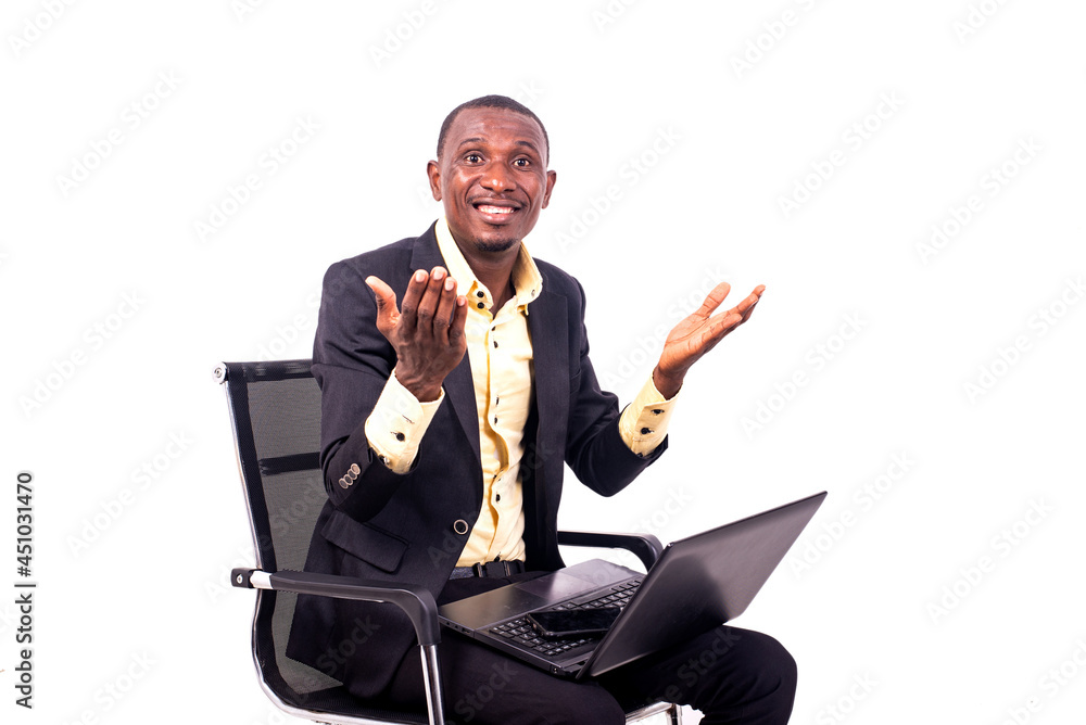 happy business man sitting with laptop on his legs smiling. happy business man sitting with laptop on his legs smiling.