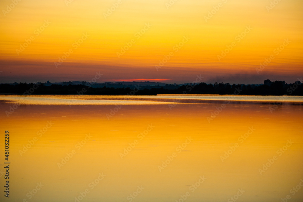 Beautiful tranquil sunset on the lake