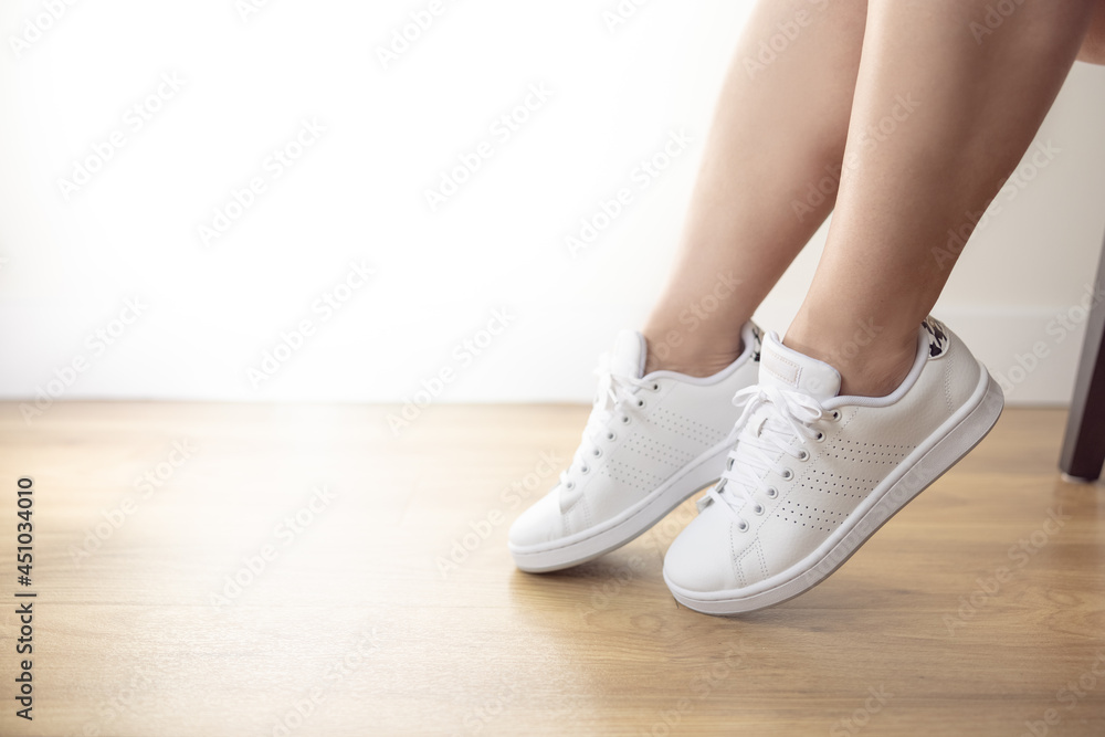 Woman in her white sneakers carefree fun
