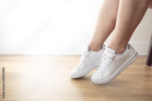 Woman in her white sneakers carefree fun