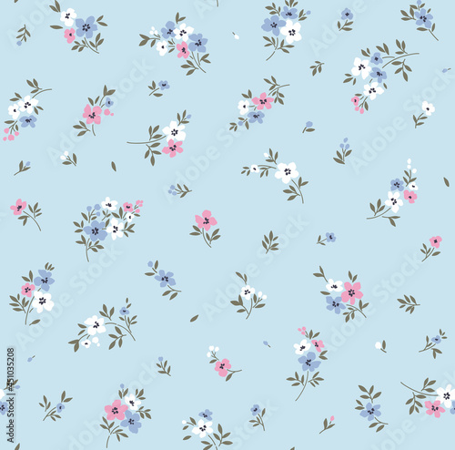 Floral pattern. Pretty flowers on light blue background. Printing with small white and pink flowers. Ditsy print. Seamless vector texture. Spring bouquet. Stock vector.