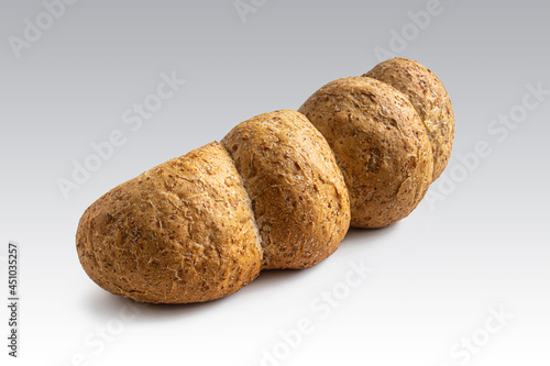 Loaf of wheat-oat bread on a light background