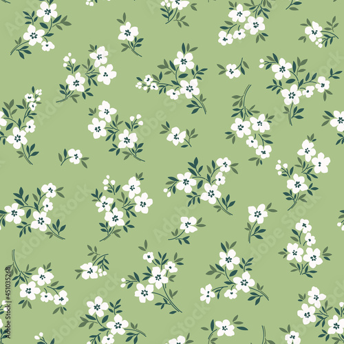 Floral pattern. Pretty flowers on pale green gray background. Printing with small white flowers. Ditsy print. Seamless vector texture. Spring bouquet. Stock vector.