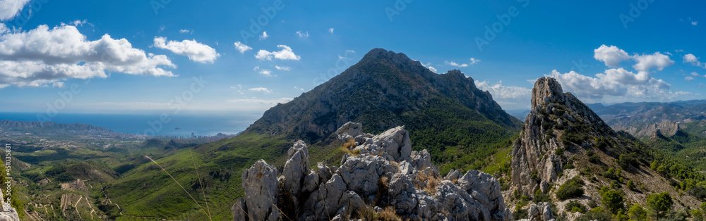 mountains and a beatiful sky since ponoig mountain and Benidorm city on background. mediterranean coast landscape located in the Valencian Community, Alicante, Spain