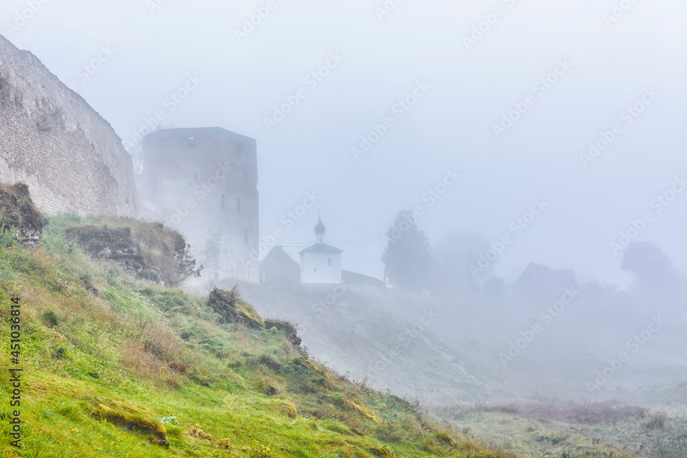 A foggy autumn morning in the ancient city of Izborsk.