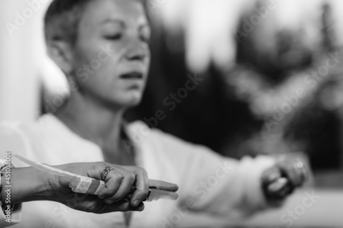 Guardian Angel Virtue, Hand of a Spiritual Healer Holding a Crystal with White Feather © Microgen