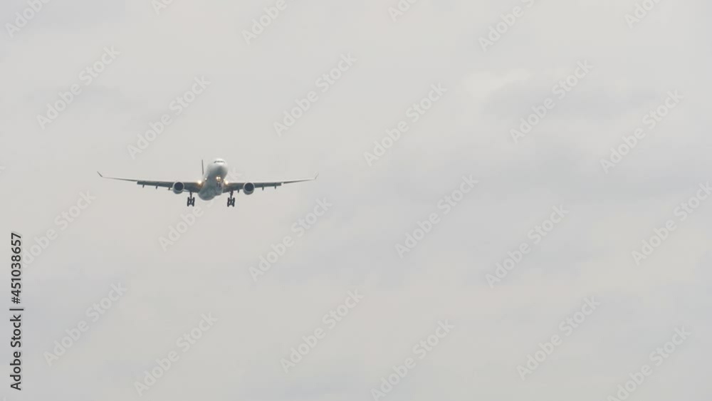 The plane is flying in the cloudy sky The plane is flying in the cloudy sky