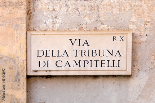 Street name voa della tribuna di campitelli - engl. street of Campinelli stage-  painted at the wall in Rome photo
