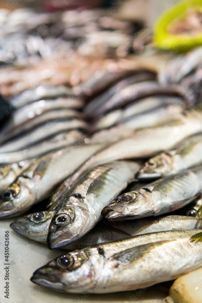 Fresh fish displayed in a traditional food market. Whiting fish