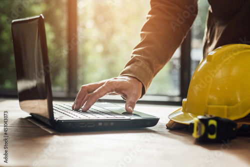 Engineering people architect meeting and pointing at drawings design project discussion working and engineer tools concept at construction site in the office.