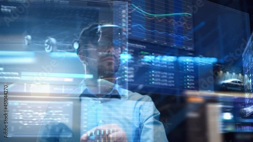 Young Adult Male Engineer Using Futuristic Augmented Reality Software Interface for Managing Work Projects. Specialist in Office Wearing Headset to Look at VFX Animation with Electric Car Concept. photo
