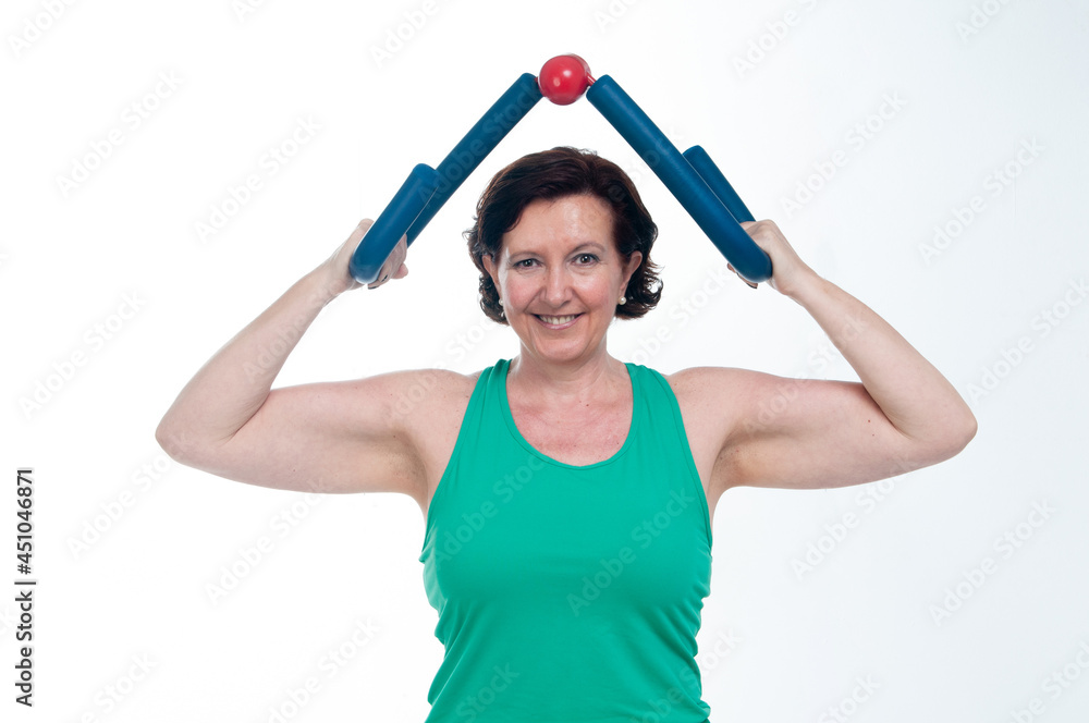 60 year old senior woman doing gymnastics on white background 60 year old senior woman doing gymnastics on white background