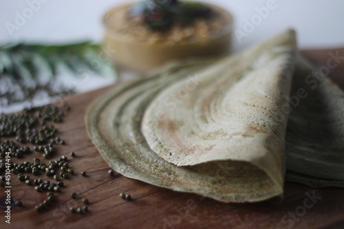Fototapeta Naklejka Na Ścianę i Meble -  Protein rich moong bean crepe, locally known as pesarattu. It looks like dosa but not made with fermented batter