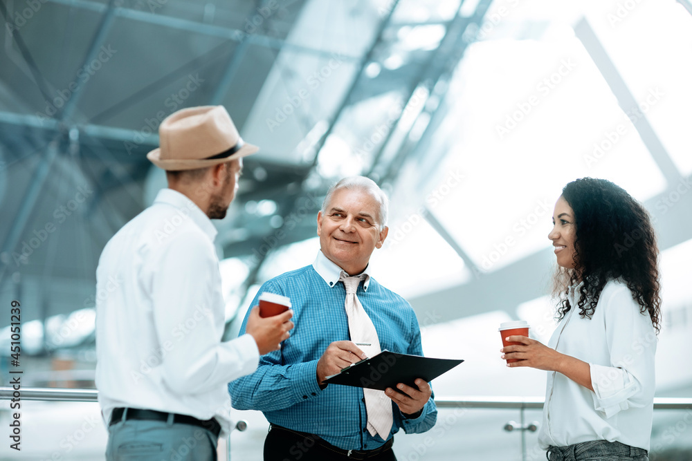 multinational group of business people discussing business docum