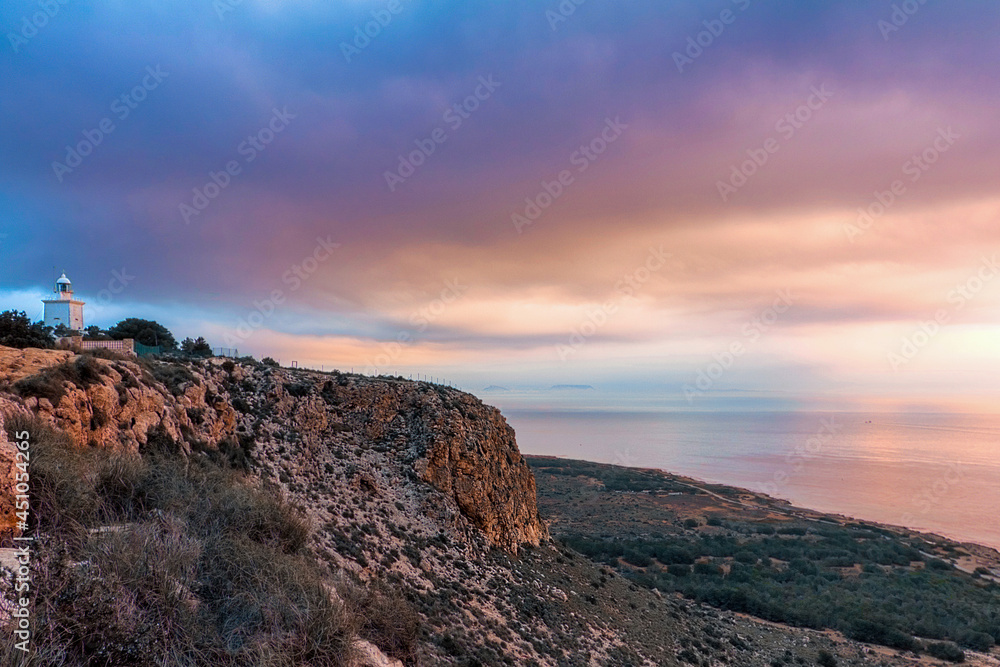 Nice sunrise at the Santa Pola lighthouse. landscape of the Mediterranean coast in the city of Santa Pola. Coastal city located in the Valencian community, Alicante, Spain