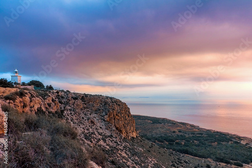 Nice sunrise at the Santa Pola lighthouse. landscape of the Mediterranean coast in the city of Santa Pola. Coastal city located in the Valencian community, Alicante, Spain