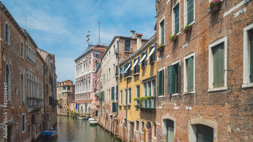Canal between venetian houses in Venice, Italy