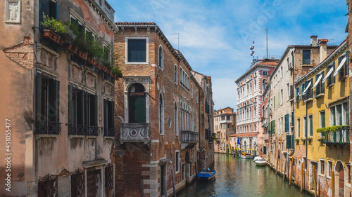 Canal between venetian houses in Venice, Italy © Mark Zhu