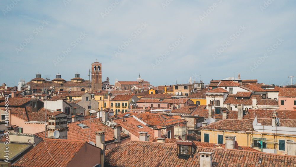 Tower over traditional Venetian houses, Venice, Italy