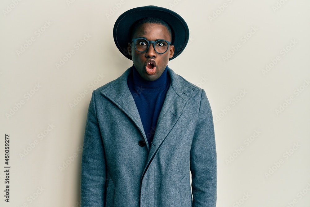 Young african american man wearing elegant style afraid and shocked with surprise expression, fear and excited face. Young african american man wearing elegant style afraid and shocked with surprise expression, fear and excited face.