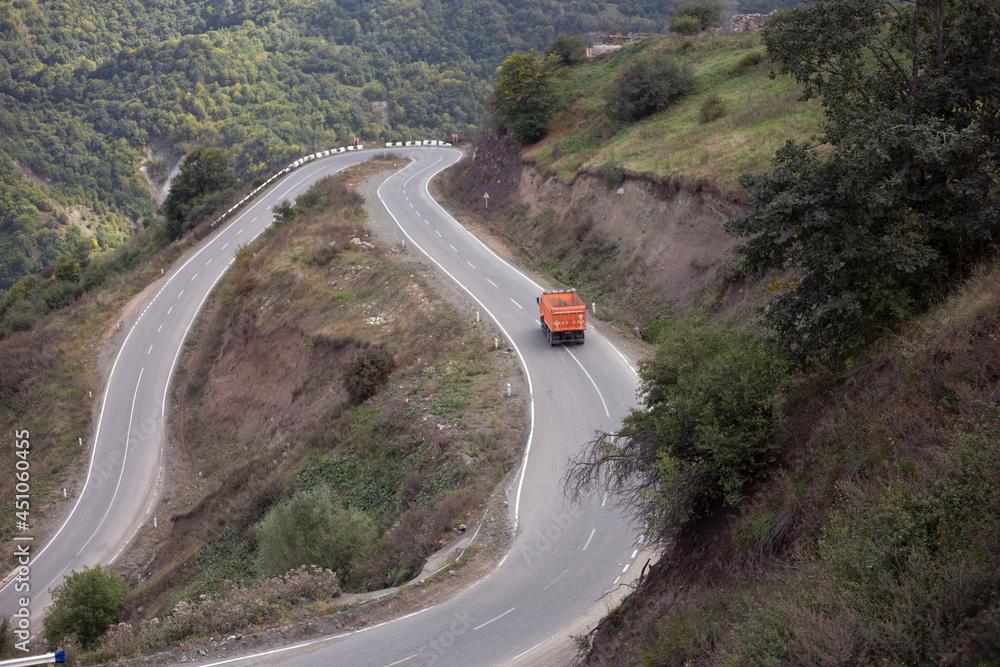 orange truck in the  road