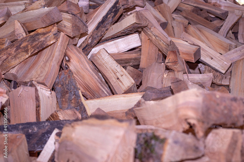 fire wood background texture. closeup of chopped fire wood stack