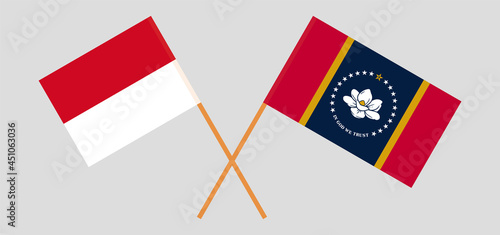 Crossed flags of Monaco and the State of Mississippi. Official colors. Correct proportion