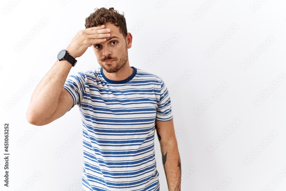 Handsome young man standing over isolated background worried and stressed about a problem with hand on forehead, nervous and anxious for crisis Handsome young man standing over isolated background worried and stressed about a problem with hand on forehead, nervous and anxious for crisis