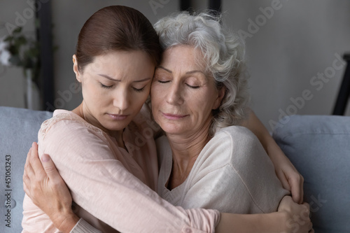 Photography Caring millennial woman child embrace unhappy upset old 60s mother show love and care