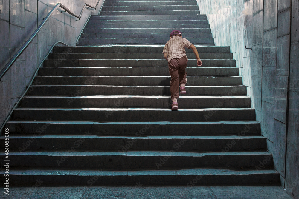 A boy running up the stairs to infinity. A boy running up the stairs to infinity.
