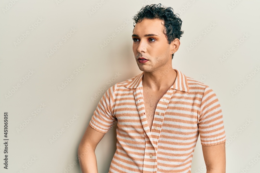 Obraz premium Handsome man wearing make up wearing casual shirt stressed and frustrated with hand on head, surprised and angry face