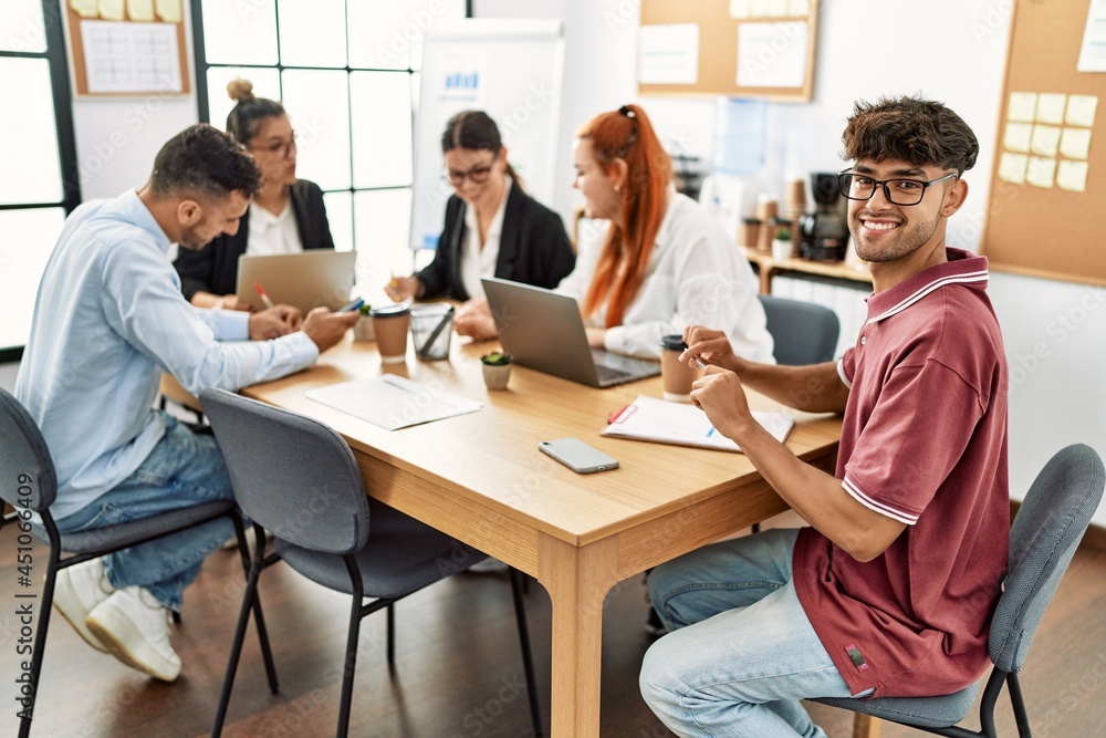 Group of business workers smiling happy working at the office Group of business workers smiling happy working at the office