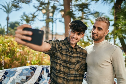 Young gay couple smiling happy making selfie by the smartphone at the city. © Krakenimages.com