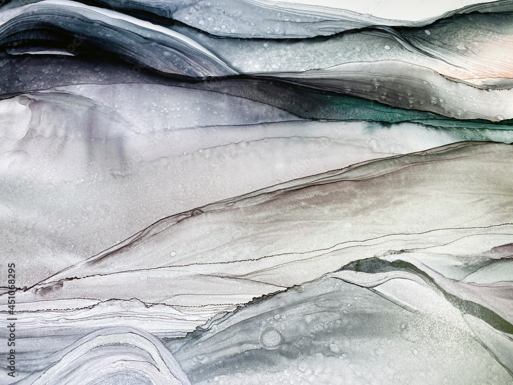 Abstract grey art with purple, green and silver paint — pearly background with beautiful smudges and plisse made with alcohol ink. Grey fluid texture resembles marble, smoke, watercolor or aquarelle. 