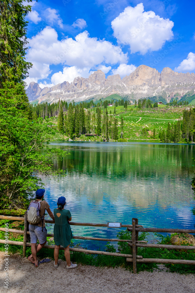 Paradise scenery at Karersee (Lago di Carezza, Carezza lake) in Dolomites of Italy at Mount Latemar, Bolzano province, South tyrol. Blue and crystal water. Travel destination of Europe.