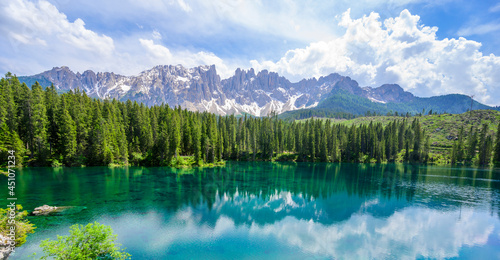 Paradise scenery at Karersee (Lago di Carezza, Carezza lake) in Dolomites of Italy at Mount Latemar, Bolzano province, South tyrol. Blue and crystal water. Travel destination of Europe. photo