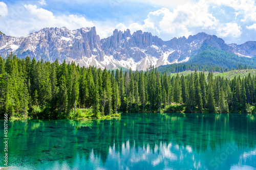 Paradise scenery at Karersee (Lago di Carezza, Carezza lake) in Dolomites of Italy at Mount Latemar, Bolzano province, South tyrol. Blue and crystal water. Travel destination of Europe. © Simon Dannhauer