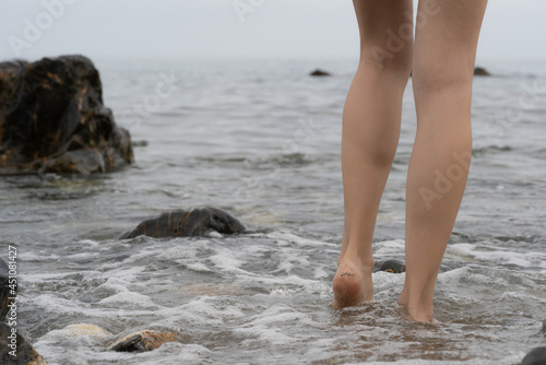 Canvas Print walking woman on the beach legs and foots