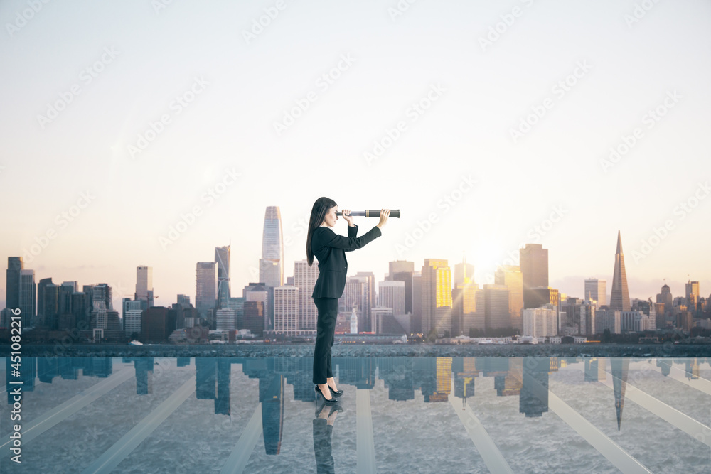 Business woman on glass balcony looking into the distance with telescope at city with mock up place. Success and future concept. Business woman on glass balcony looking into the distance with telescope at city with mock up place. Success and future concept.
