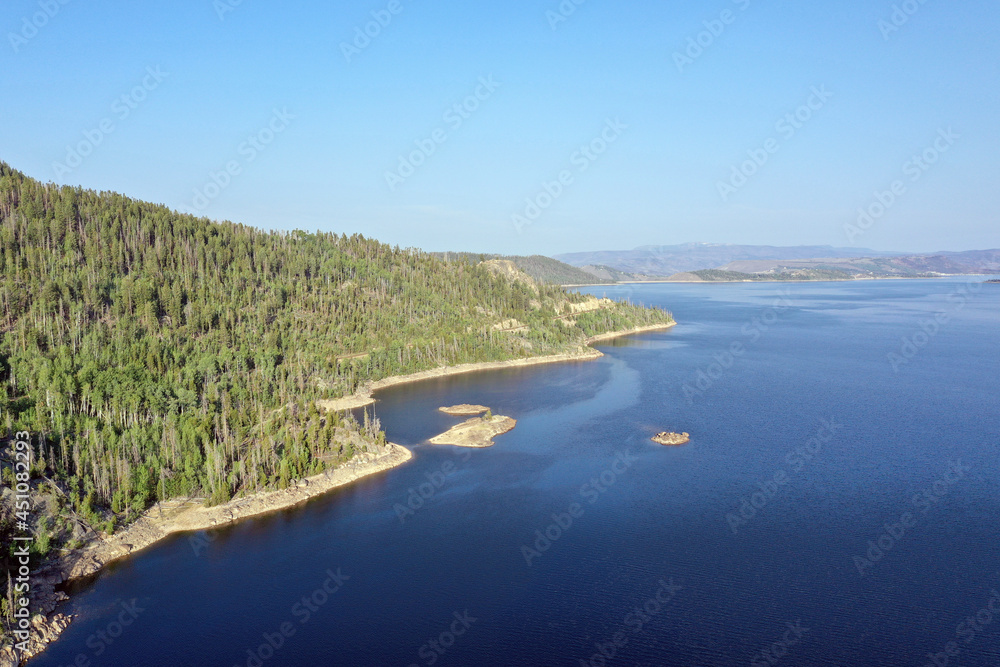 Aerial view of Lake Granby, Colorado and surrounding mountains and forests on clear calm summer morning. Aerial view of Lake Granby, Colorado and surrounding mountains and forests on clear calm summer morning.