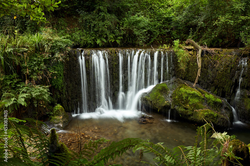 Fototapeta Naklejka Na Ścianę i Meble -  Beautiful waterfall in a forest in Galicia, Spain, known by the name of San Pedro de Incio.