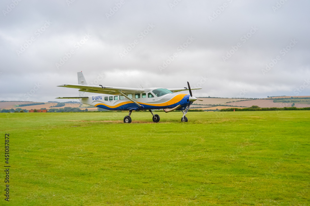 A small plane from 'GoSkydive' awaits people to land for parachute jumping A small plane from 'GoSkydive' awaits people to land for parachute jumping