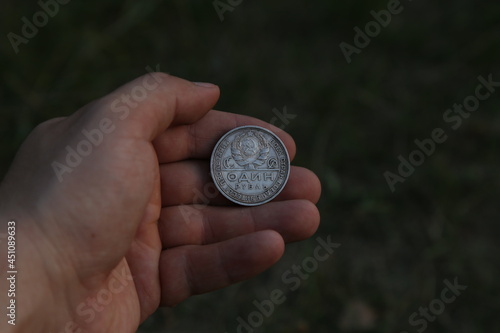 Old silver soviet coin half ruble in hand