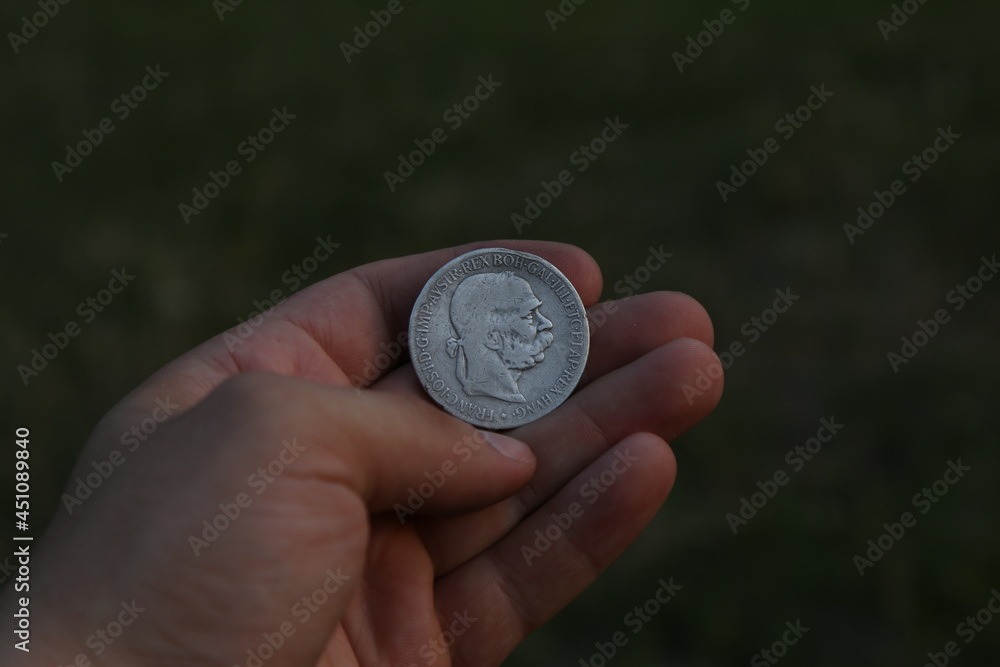 Old silver Polish coin in hand Old silver Polish coin in hand