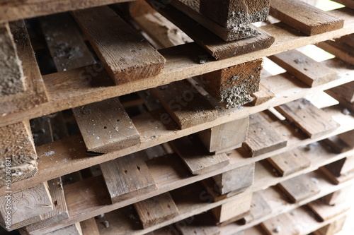 Old wooden pallets stacked on top of each other closeup