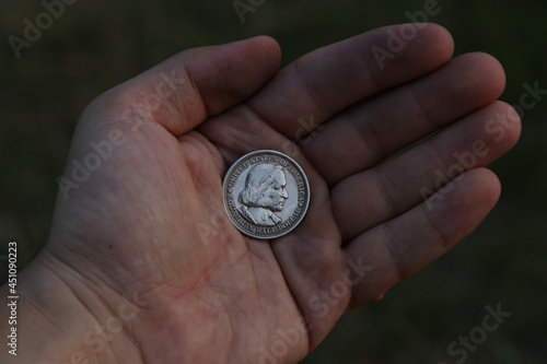 Vintage American coin half dollar in hand